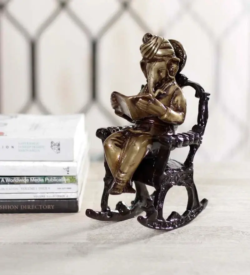 Brown Brass Lord Ganesha Idol On Rocking Chair Showpiece