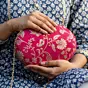 Women Magenta Pink Based Silver Floral Pattern Brocade Fabric Oval Clutch