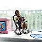 Brown Brass Lord Ganesha Idol On Rocking Chair Showpiece