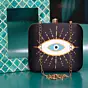 Woman Orange-White Evil Eye Printed Clutch