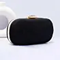 Woman Black Based Shiny Fabric Capsule Shaped Clutch