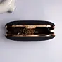 Woman Black Based Shiny Fabric Capsule Shaped Clutch