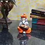 Orange Polyresin Lord Ganesha playing Dholak Idol