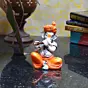 Orange Polyresin Lord Ganesha Playing Flute Idol