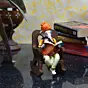 Orange Polyresin Lord Ganesha Idol reading Book on Wooden Chair