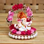 Polyresin Lord Ganesha Idol on Decorative Handcrafted Plate with Throne of Pink and Red Flowers