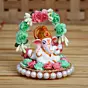Lord Ganesha Idol On Decorative Handicrafted Plate With Throne Of Pink And Green Flowers