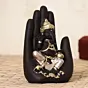 Black and Golden Handcrafted Polyresin Palm Ganesha Idol