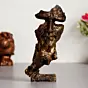 Brown Polyresin Antique Finish man with finger on lips Handcrafted Decorative Showpiece