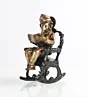 Brown Brass Lord Ganesha Idol On Rocking Chair Showpiece