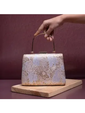 Woman White Based Golden Floral Brocade Fabric Clutch