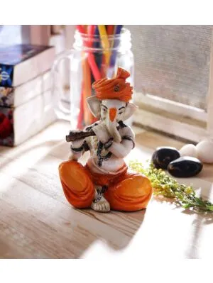 Orange Polyresin Lord Ganesha Playing Flute Idol