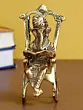 Golden Metal Lord Ganesha Idol Reading Book on Rocking Chair
