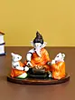 Orange and White Polyresin Handcrafted Lord Ganesha Idol Doing Havan with 2 Mushaks