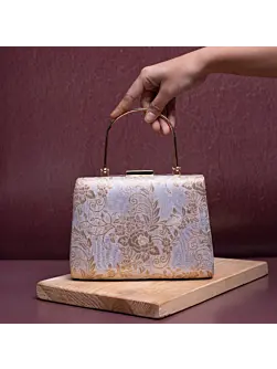 Woman White Based Golden Floral Brocade Fabric Clutch