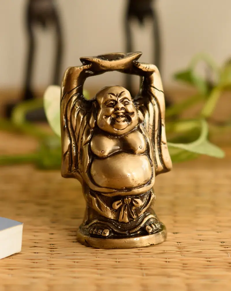 Standing Laughing buddha statue holding a gold ingot, with his hands upright