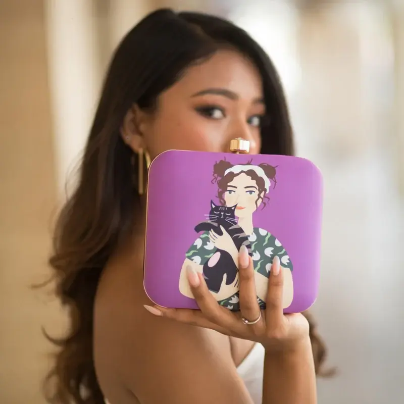 Women Glam Girl and Cat Printed Clutch With Vibrant Purple Background