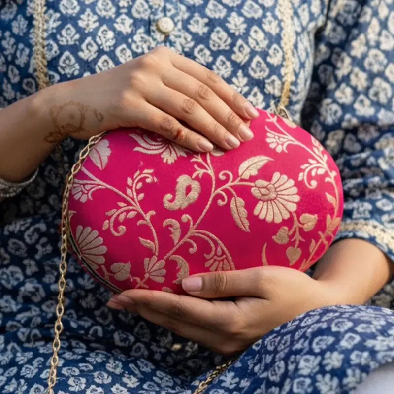 Women Magenta Pink Based Silver Floral Pattern Brocade Fabric Oval Clutch