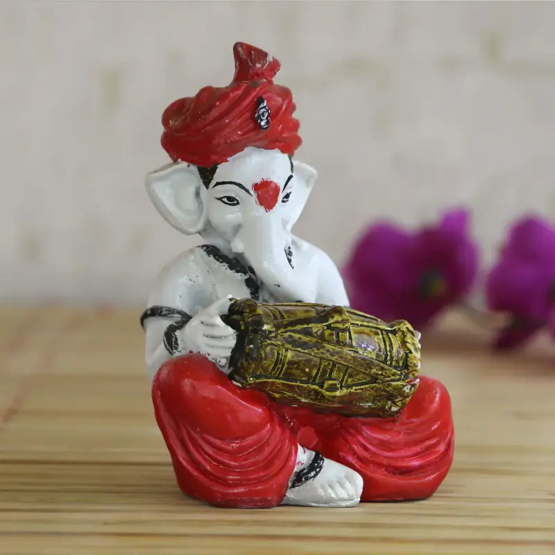 Lord Ganesha Idol Playing Dholak Musical Instrument